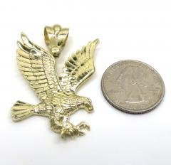 14k yellow gold medium diamond cut flying eagle pendant