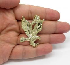 14k yellow gold medium diamond cut flying eagle pendant