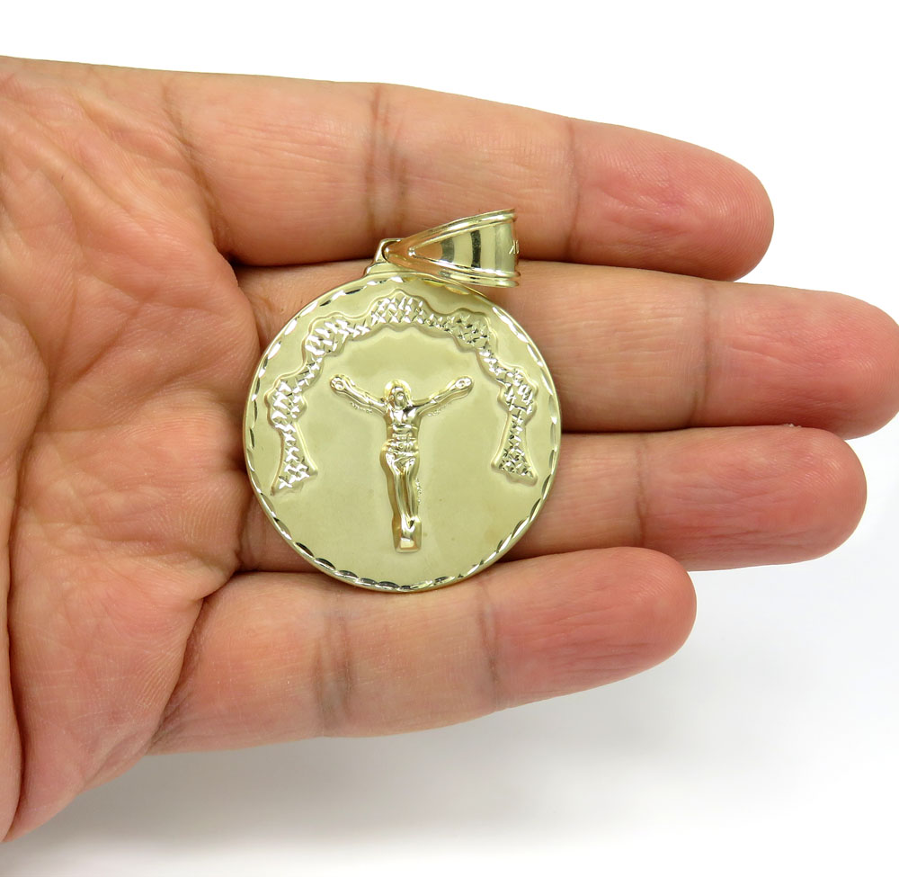 10k yellow gold diamond cut medium hanging jesus pendant 